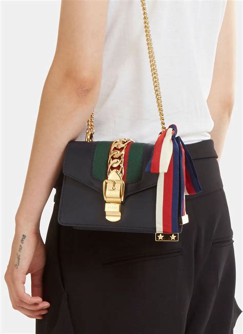 gucci sylvie mini chain bag navy|GUCCI Textured Calfskin Super Mini Sylvie Chain Shoulder Bag .